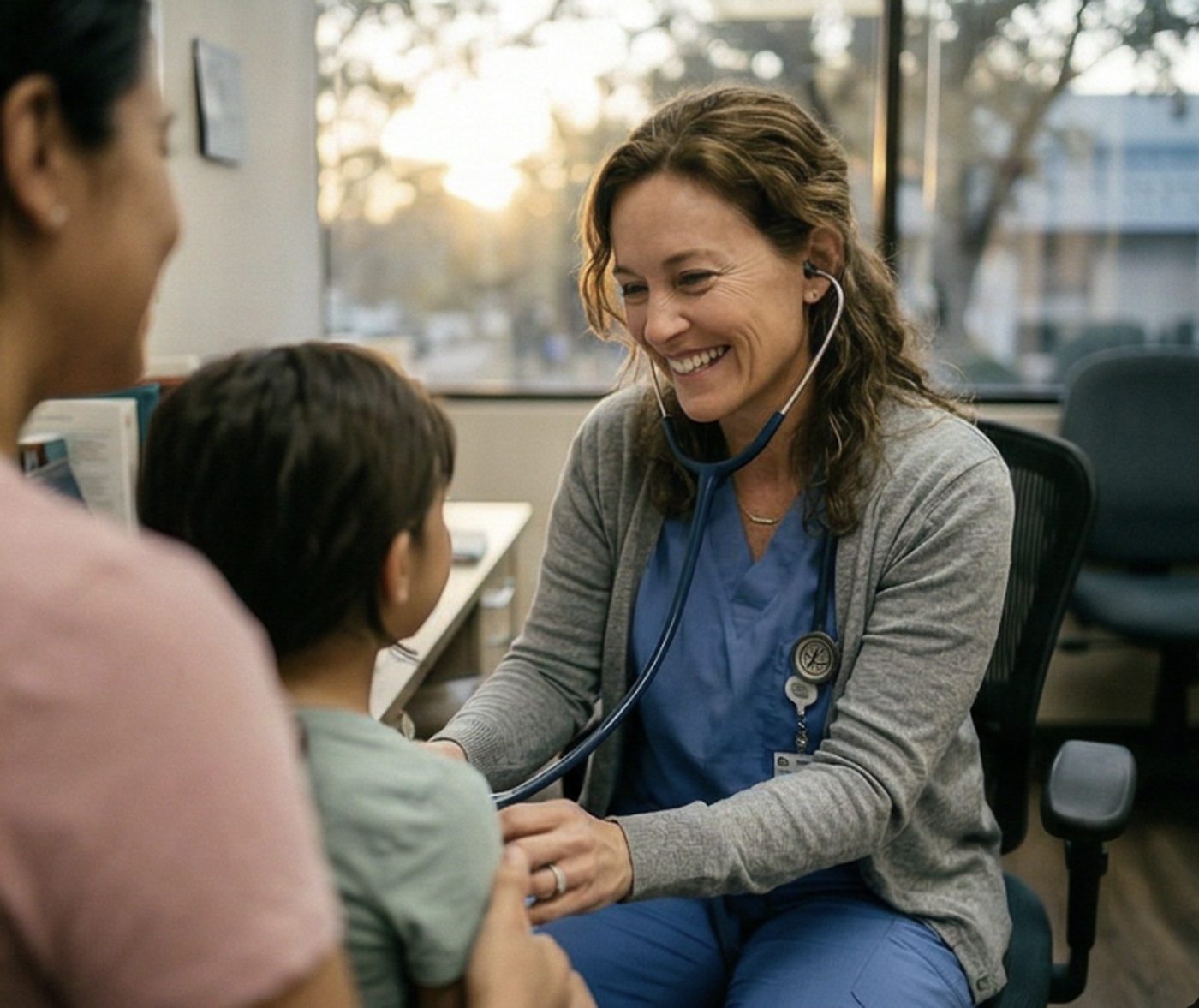 Dr. Maya Reyes laughing with a child and their parent during a visit